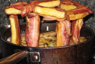 Illustration for article titled 10 Meat Structures That Require Engineering Degrees to Build and a Death Wish to Eat